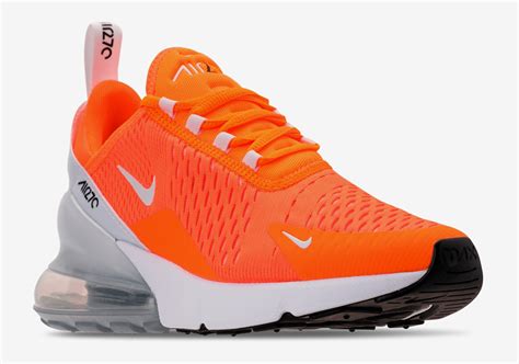 orange and white Nike 270